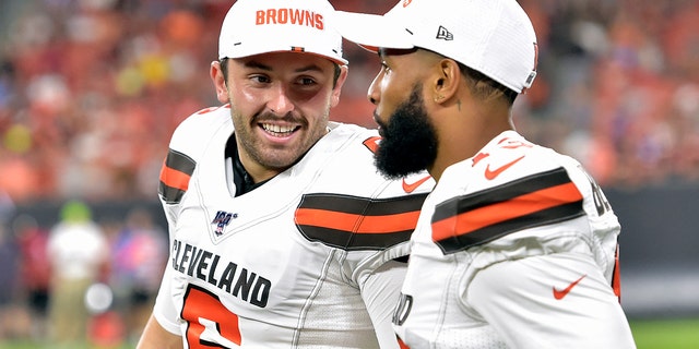 FILE - In this Aug. 8, 2019, file photo, Cleveland Browns' Baker Mayfield, left, smiles as he talks with wide receiver Odell Beckham Jr. during the second half of an NFL preseason football game against the Washington Redskins in Cleveland. Beckham believes the Browns offense will come around. (AP Photo/David Richard, File)
