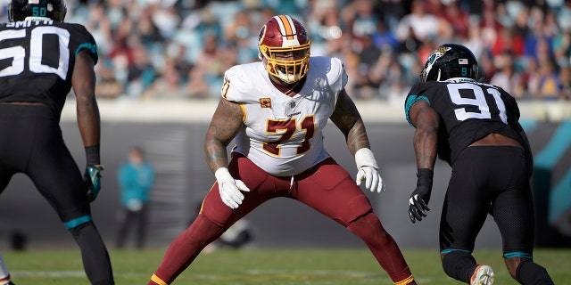 FILE - In this Dec. 16, 2018, file photo, Washington Redskins offensive tackle Trent Williams (71) sets up to block in front of Jacksonville Jaguars defensive end Yannick Ngakoue (91) during the second half of an NFL football game in Jacksonville, Fla. (AP Photo/Phelan M. Ebenhack, File)