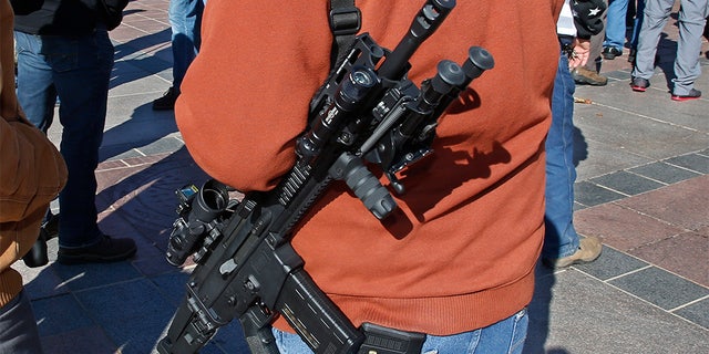 Gun advocates attend a rally at the state Capitol to mark the start of a new law that allows most adults in Oklahoma to carry a firearm in public without a background check or training, Friday, Nov. 1, 2019, in Oklahoma City.