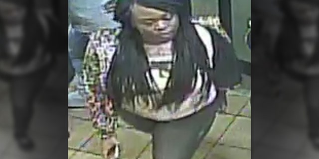 Police say this woman who left with the suspect is considered a person of interest.