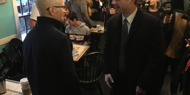 Presidential candidate Pete Buttigieg greeting supporters at a cafe in Portsmouth, N.H., on Monday.