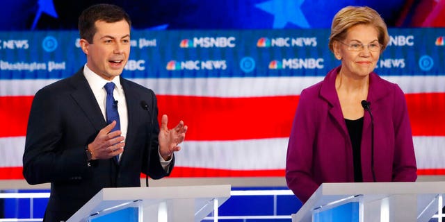 Democratic presidential candidate South Bend, Ind., Mayor Pete Buttigieg speaks as Democratic presidential candidate Sen. Elizabeth Warren, D-Mass., listens during a Democratic presidential primary debate, Wednesday, Nov. 20, 2019, in Atlanta. (AP Photo/John Bazemore)