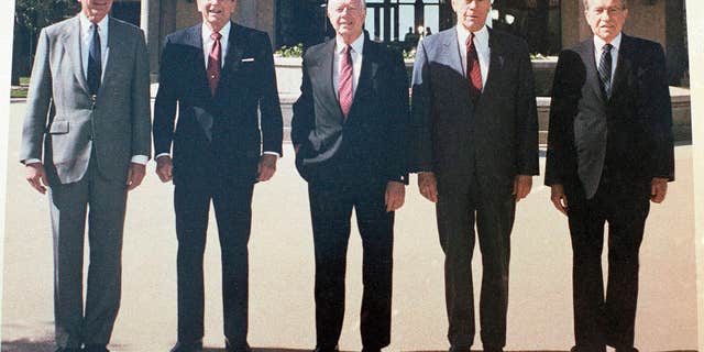 Former Presidents, from left, George H. W. Bush, Ronald Reagan, Jimmy Carter, Gerald Ford and Richard Nixon shown in the courtyard during the dedication of the Ronald Reagan Presidential Library in Simi Valley, Calif., on Nov. 4, 1991. (AP Photo/Marcy Nighswander)