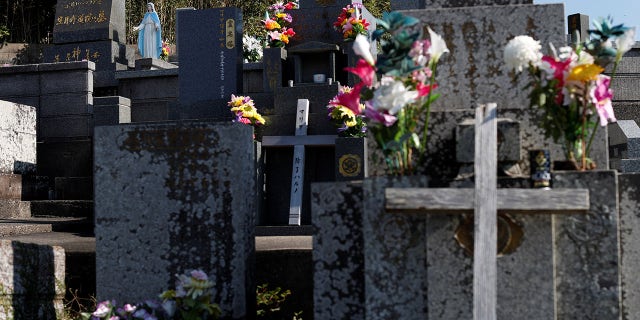 A statue of Virgin Mary is seen on a gravestone of descendants of 'Hidden Christians' who preserved their faith in secret during centuries of persecution, at a cemetery on Ikitsuki Island, Nagasaki Prefecture, Japan, November 6, 2019. REUTERS/Issei Kato