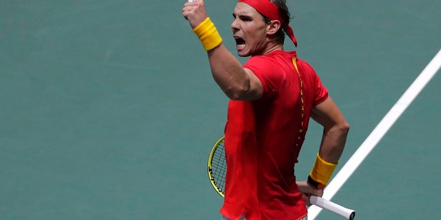 Spain's Rafael Nadal celebrates celebrates a point against Russia's Karen Khachanov during their Davis Cup tennis match in Madrid, Spain, Tuesday, Nov. 19, 2019. (AP Photo/Manu Fernandez)