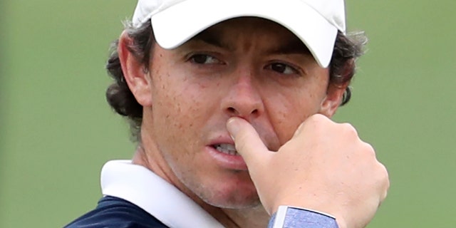 Rory McIlroy of Northern Ireland studies his play on the 2nd hole during the first round of the DP World Tour Championship golf tournament in Dubai, United Arab Emirates, Thursday, Nov. 21, 2019. (AP Photo/Kamran Jebreili)