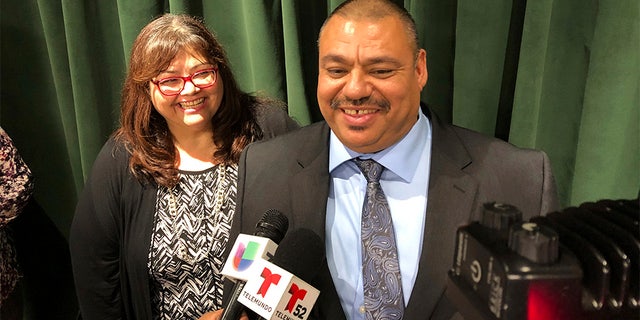 Ruben Martinez Jr., right, and his wife, Maria, left, spoke to reporters at the Hall of Justice in downtown Los Angeles, on Tuesday, Nov. 12. (AP Photo/Brian Melley)