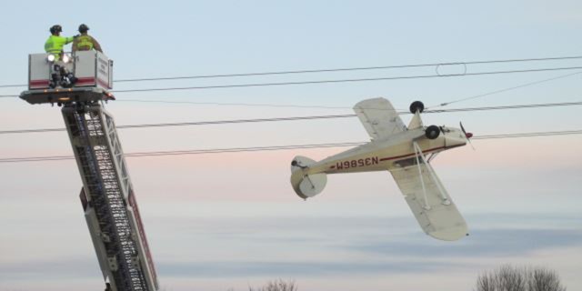 Thomas Koskovich, 65, was safely rescued Saturday after his Piper Cub single-engine plane became entangled in power lines in Louisville Township, Minnesota.