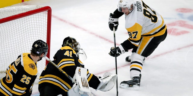 Boston Bruins goaltender Jaroslav Halak (41) makes a save on a shot by Pittsburgh Penguins center Sidney Crosby (87) during the first period of an NHL hockey game in Boston, Monday, Nov. 4, 2019. (AP Photo/Charles Krupa)