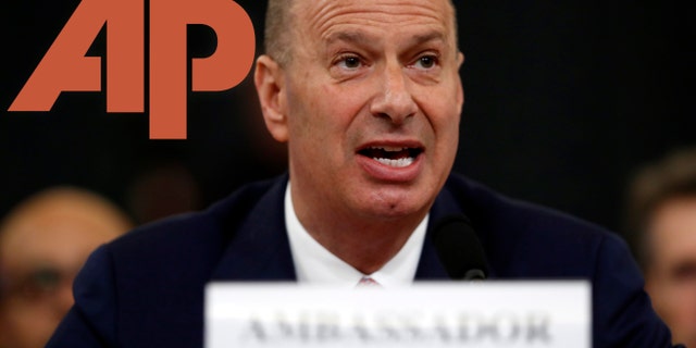 The Associated Press was forced to take down a tweet about President Trump and U.S. Ambassador to the European Union Gordon Sondland, who testified before House lawmakers Wednesday. (AP Photo/Andrew Harnik, Montage)
