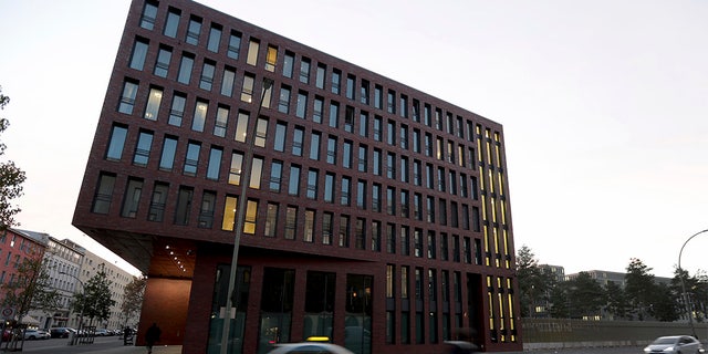 Cars drive past the center for advanced education (ZNAF) at the Federal Intelligence Service (BND) in Berlin Tuesday. (AP Photo/Michael Sohn)