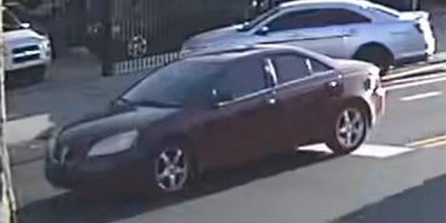 Police said the gunfire came from the backseat of a red or maroon Pontiac G6 (pictured here).