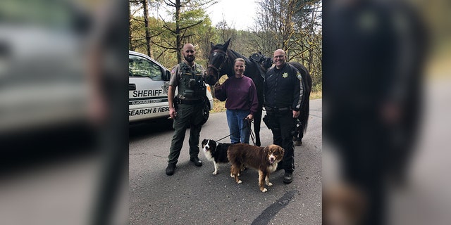 Tammy Stevens, center, with her horse Bo, and her miniature Australian Shepherds Maddie and Wilson. Wilson is the brown dog.