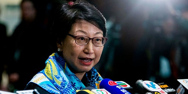 Hong Kong's justice secretary Teresa Cheng speaks to the media at the Legislative Council in Hong Kong on January 24, 2018, after answering lawmakers' questions about illegal structures found at some of the properties she owns. / AFP PHOTO / ISAAC LAWRENCE (Photo credit should read ISAAC LAWRENCE/AFP via Getty Images)