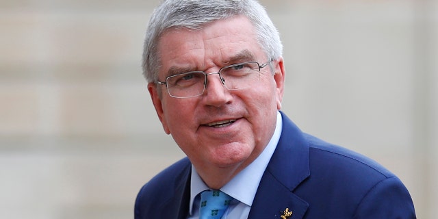 In this June 7, 2019, photo, International Olympic Committee (IOC) president Thomas Bach arrives to meet French President Emmanuel Macron at the Elysee Palace in Paris. An international trade union wants Bach to intervene and investigate alleged labor and safety violations at venues being built for next year’s Tokyo Olympics. (AP Photo/Francois Mori, File)