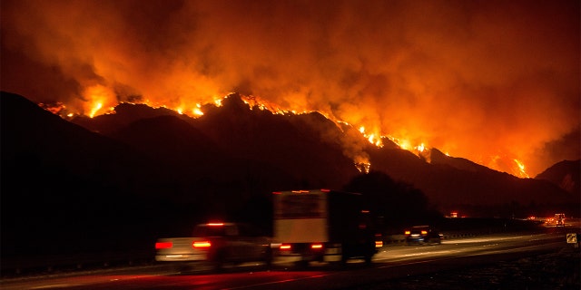 The Thomas Fire crests a mountain near Lake Casitas on December 5, 2017. (Photo by Justin L. Stewart/Getty Images)