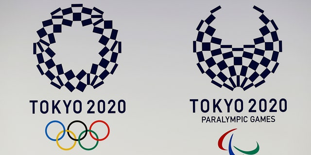 FILE - In this April 25, 2016, file photo, official logos of the 2020 Tokyo Olympics, left, and the 2020 Tokyo Paralympic Games are displayed by the Tokyo Organizing Committee, in Tokyo. Tokyo’s Olympic marathons and race walks, which moved last month to the northern city of Sapporo to avoid the capital’s summer heat, is likely to start and finish in the city’s Odori Park according to officials Monday. (AP Photo/Shizuo Kambayashi, File)