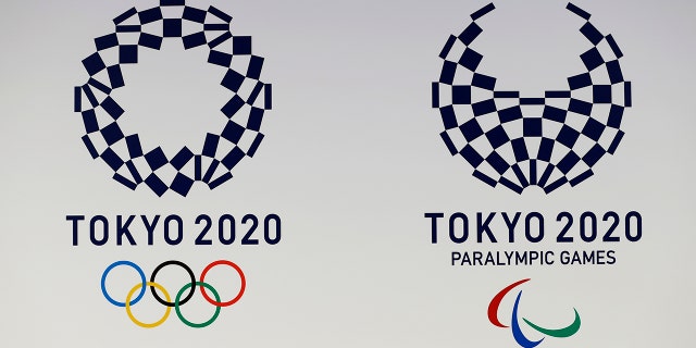 FILE - In this April 25, 2016, file photo, official logos of the 2020 Tokyo Olympics, left, and the 2020 Tokyo Paralympic Games are displayed by the Tokyo Organizing Committee, in Tokyo. Tokyo’s Olympic marathons and race walks, which moved last month to the northern city of Sapporo to avoid the capital’s summer heat, is likely to start and finish in the city’s Odori Park according to officials Monday. (AP Photo/Shizuo Kambayashi, File)