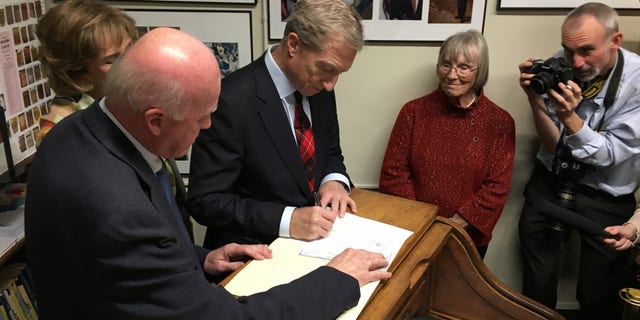 Tom Steyer files to place his name on New Hampshire's presidential primary ballot, at the Statehouse in Concord Tuesday.