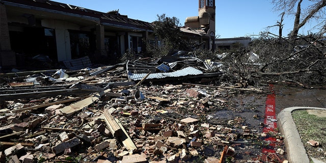Debris litters the Preston Royal shopping area in Dallas Oct. 21. (Photo by Ronald Martinez/Getty Images)