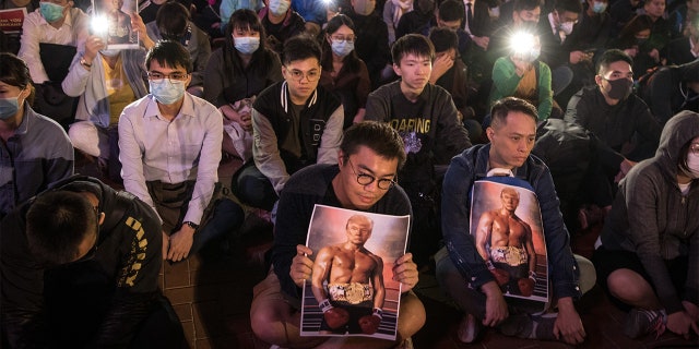Pro-democracy protesters hold posters of US President Donald Trump during a Thanksgiving Day rally at Edinburgh Place on November 28, 2019 in Hong Kong, China.