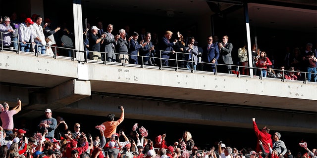 President Donald Trump and first lady Melania Trump attend Saturday's game between LSU and Alabama. (Photo by Kevin C. Cox/Getty Images)