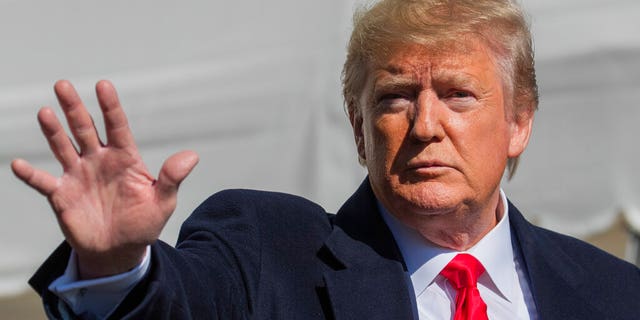 President Donald Trump waves after speaking to reporters upon arrival at the White House in Washington, Sunday, Nov. 3, 2019. (AP Photo/Manuel Balce Ceneta)
