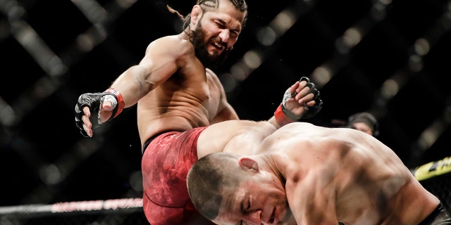 Jorge Masvidal, left, kicks Nate Diaz during the first round of a welterweight mixed martial arts bout at UFC 244 early Sunday, Nov. 3, 2019, in New York. (Associated Press)