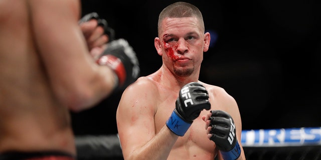 Nate Diaz, right, fights Jorge Masvidal during the first round of a welterweight mixed martial arts bout at UFC 244 early Sunday, Nov. 3, 2019, in New York. Masvidal stopped Diaz in the fourth round. (AP Photo/Frank Franklin II)