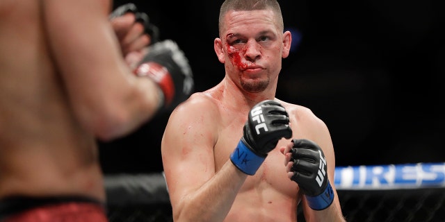 Nate Diaz, right, fights Jorge Masvidal during the first round of a welterweight mixed martial arts bout at UFC 244 early Sunday, Nov. 3, 2019, in New York. Masvidal stopped Diaz in the fourth round. (AP Photo/Frank Franklin II)