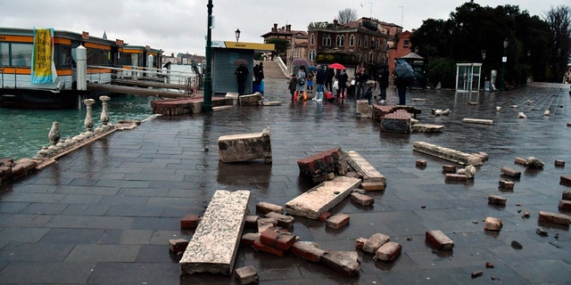 Parts of a dock lie damaged, in Venice, Italy, Wednesday, Nov. 13, 2019.