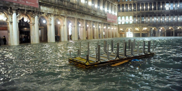 An overturned catwalk used as a walkway during high water floats in an over flooded St. Mark's Square late Tuesday, Nov. 12, 2019.