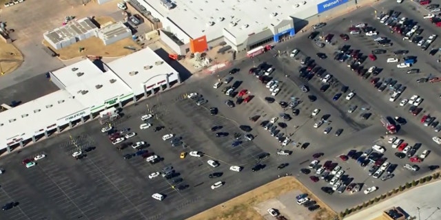 The parking lot of the Walmart was covered in police tape after a reported shooting in Duncan, Okla.