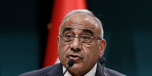 In this May 15, 2019 file photo, Iraqi Prime Minister Adel Abdul-Mahdi speaks to the media during a joint news conference with Turkish President Recep Tayyip Erdogan, in Ankara, Turkey. Abdul-Mahdi said Friday, he would submit his resignation to parliament, a day after more than 40 people were killed by security forces and following calls by Iraq's top Shiite cleric for lawmakers to withdraw support. (AP Photo/Burhan Ozbilici, File)