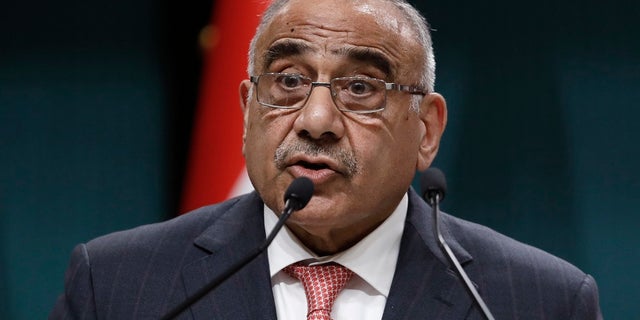In this May 15, 2019 file photo, Iraqi Prime Minister Adel Abdul-Mahdi speaks to the media during a joint news conference with Turkish President Recep Tayyip Erdogan, in Ankara, Turkey. Abdul-Mahdi said Friday, he would submit his resignation to parliament, a day after more than 40 people were killed by security forces and following calls by Iraq's top Shiite cleric for lawmakers to withdraw support. (AP Photo/Burhan Ozbilici, File)