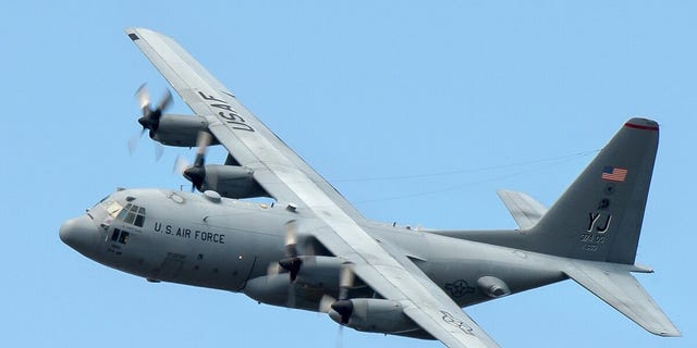 A U.S. Air Force C-130 Hercules aircraft flies over Yokota Air Base in Japan, Sept. 24, 2013. (U.S. Air Force photo/Osakabe Yasuo)