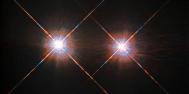 The Alpha Centauri group is the closest star - or solar - system outside of our own at a distance of 4.3 lightyears, and it can be found in the night sky in the constellation Centaurus. The stars Alpha Centauri A and Alpha Centauri B comprise a binary system, in which the two stars orbit one another, and close by is an additional faint red dwarf Alpha Centauri C, also called Proxima Centauri. Some astronomers have hoped to someday find an exoplanet capable of harboring advanced life in the system, but a new study lowers those expectations while raising them for the rest of the universe. (Credit: NASA/ESA Hubble Space Telescope)