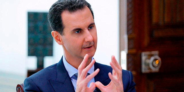 Syrian President Bashar Assad speaks during an interview in Damascus, Syria, on Friday. (AP/SANA)