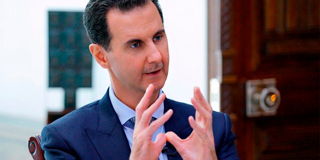 Syrian President Bashar Assad speaks during an interview in Damascus, Syria, on Friday. (AP/SANA)