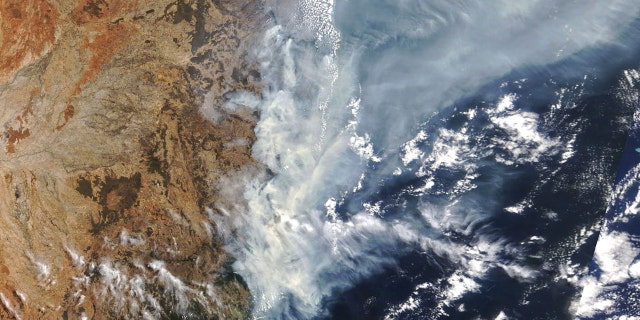 This Nov. 11, 2019, satellite photo taken by NASA shows the weather condition as bushfires burn in the eastern part of New South Wales state.