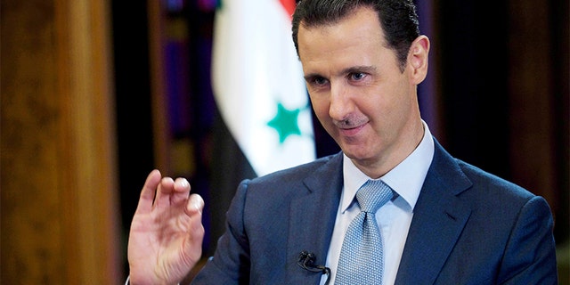 Syrian President Bashar Assad gestures during an interview in Damascus, Syria, in 2015.