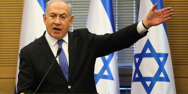 Israeli Prime Minister Benjamin Netanyahu speaks during an extended faction meeting of the right-wing bloc members at the Knesset, in Jerusalem, Wednesday, Nov. 20, 2019. (AP Photo/Oded Balilty)