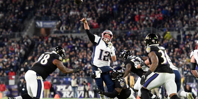 New England Patriots quarterback Tom Brady (12) attempts a pass as Baltimore Ravens linebacker Matthew Judon (99) makes a hit during the first half of an NFL football game, Sunday, Nov. 3, 2019, in Baltimore. The pass was incomplete.