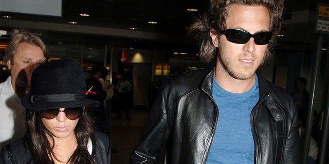 Actress Lindsay Lohan, left, and Harry Morton at London's Heathrow Airport in 2006. (AP Photo, File)