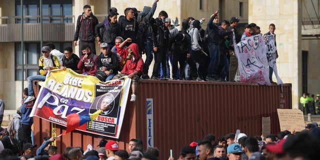 Anti-government protesters rally at the Bolivar square in Bogota, Colombia, Friday, Nov. 22, 2019. (AP Photo/Ivan Valencia)