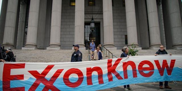 Environmental activists rally for accountability for fossil fuel companies outside of New York Supreme Court on October 22, 2019 in New York City. (Photo by Drew Angerer/Getty Images)