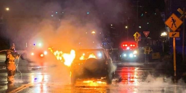The aftermath of a car fire in Stafford, Conn., where a driver pulled over to pull a man out of the burning vehicle.