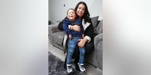 Bleu, pictured with his mother, was never expected to walk after his diagnosis.