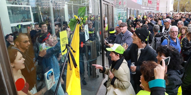 Protesters block the Italie Deux shopping mall in Paris during a demonstration called by the Extinction Rebellion activist group on Oct. 5.