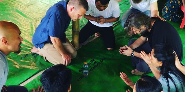Francis Chan, joined by others in his Crazy Love Ministries, pray on a summer vision trip in Hong Kong.